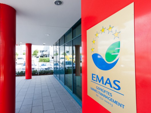 EMAS certification logo on the door of the headquarters	