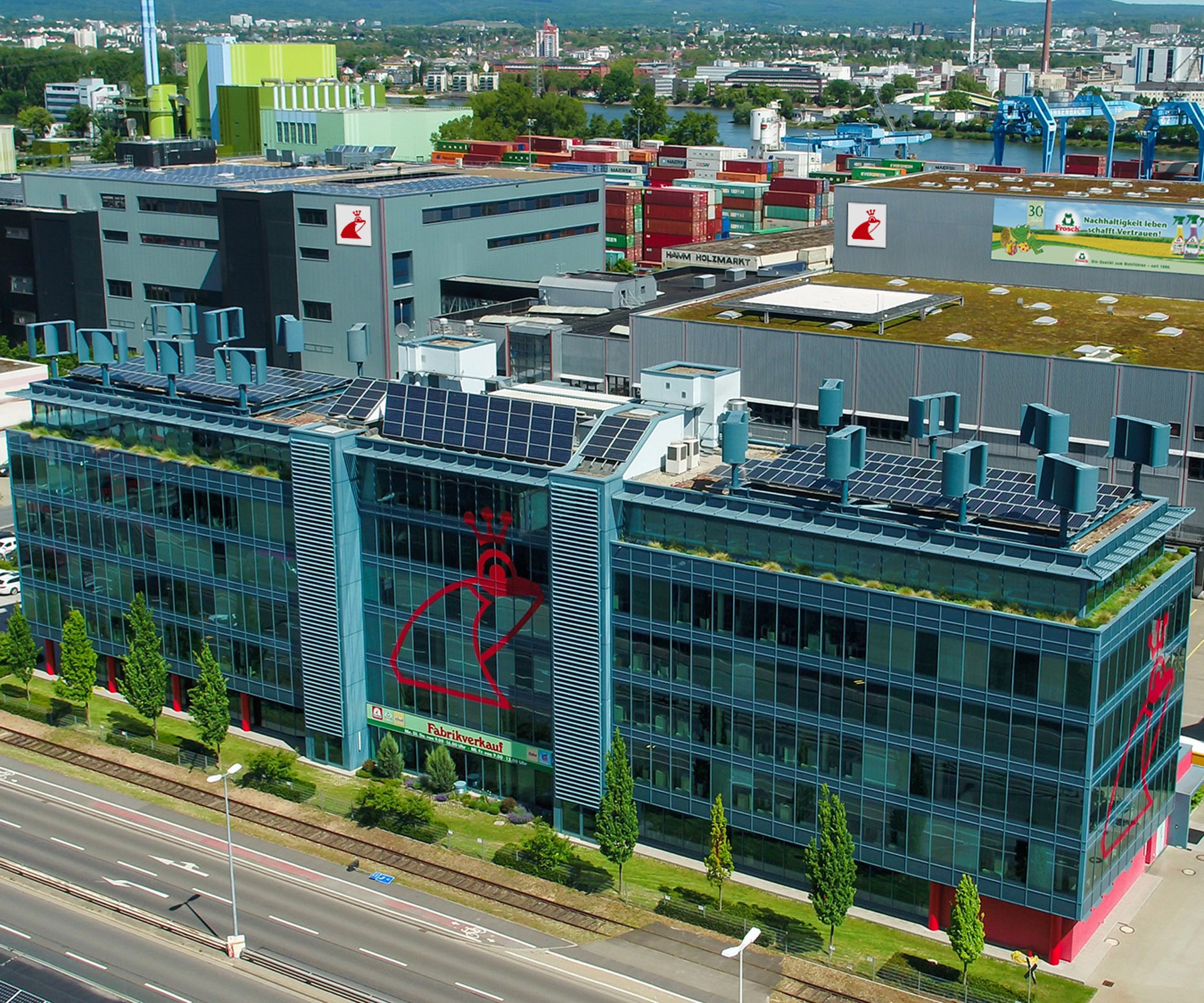 Aerial view of the Werner & Mertz headquarter with solar pannels and wind turbines on the roof	