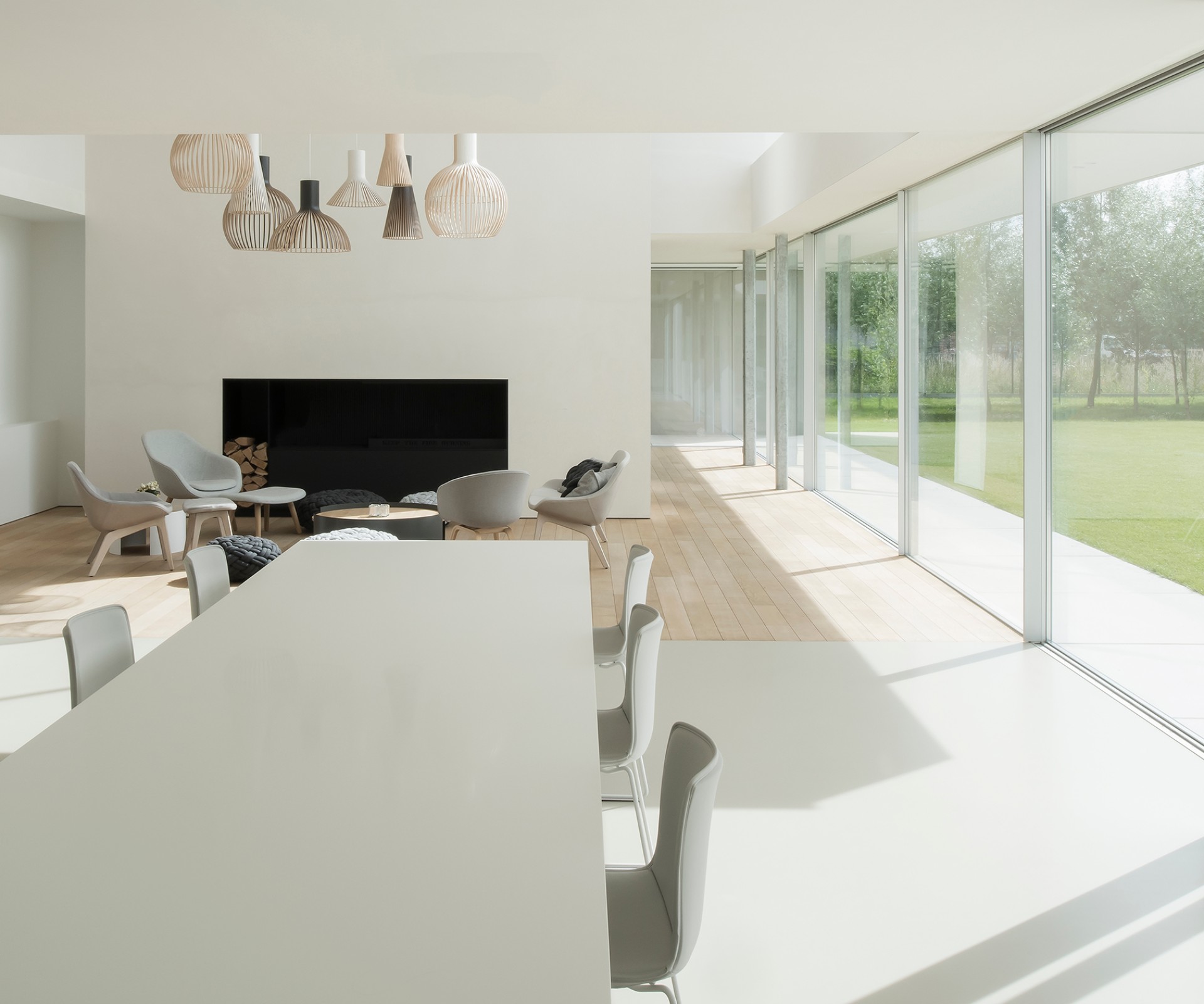 Dining table in a modern living room with a large window front	